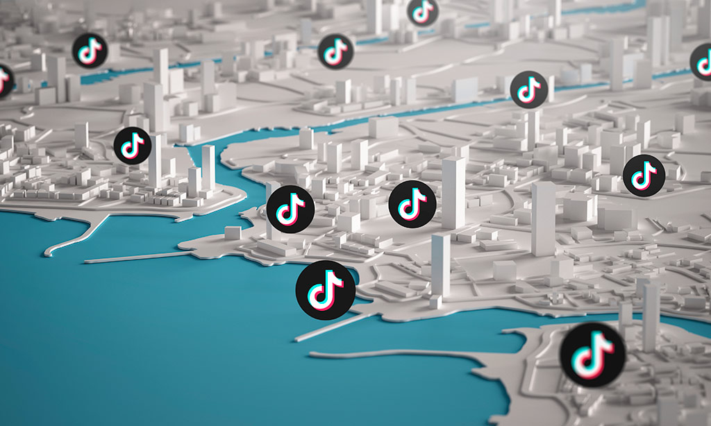 Por que utilizar TikTok vendas? : ilustra&ccedil;&atilde;o em 3d de uma parte do mapa mundial com &iacute;cones do tiktok espalhados por ele